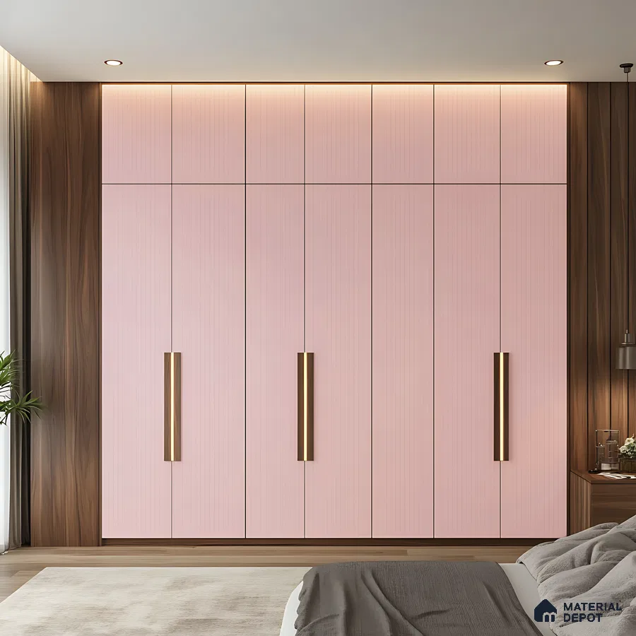 Modern Pink Fluted Wardrobe with Vertical Brass Handles in a Cozy Bedroom | Material Depot