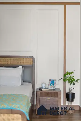 Scandinavian bedroom with natural cane and walnut wood bed, white panelled wall, and wooden flooring of 2 BHK in Purva Palm Beach Hennur Bengaluru | Material Depot