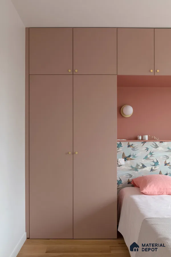 Scandinavian bedroom with pastel pink laminate wardrobe, bird motif wallpaper, and light wood flooring | Material Depot