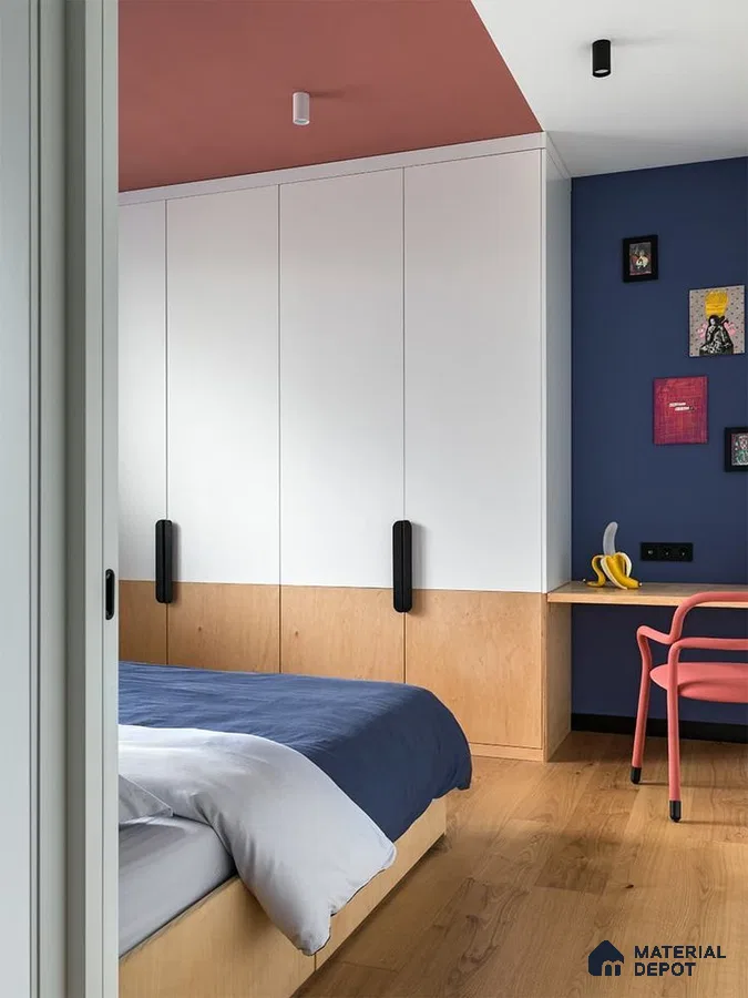 Scandinavian bedroom with white and birch wardrobe, blue accent wall, and natural wood flooring | Material Depot
