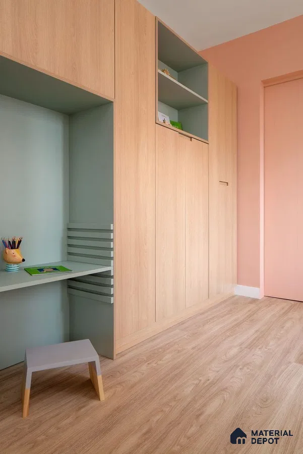 Scandinavian kids room with light oak laminate wardrobe, pastel green study nook, and peach wall paint | Material Depot