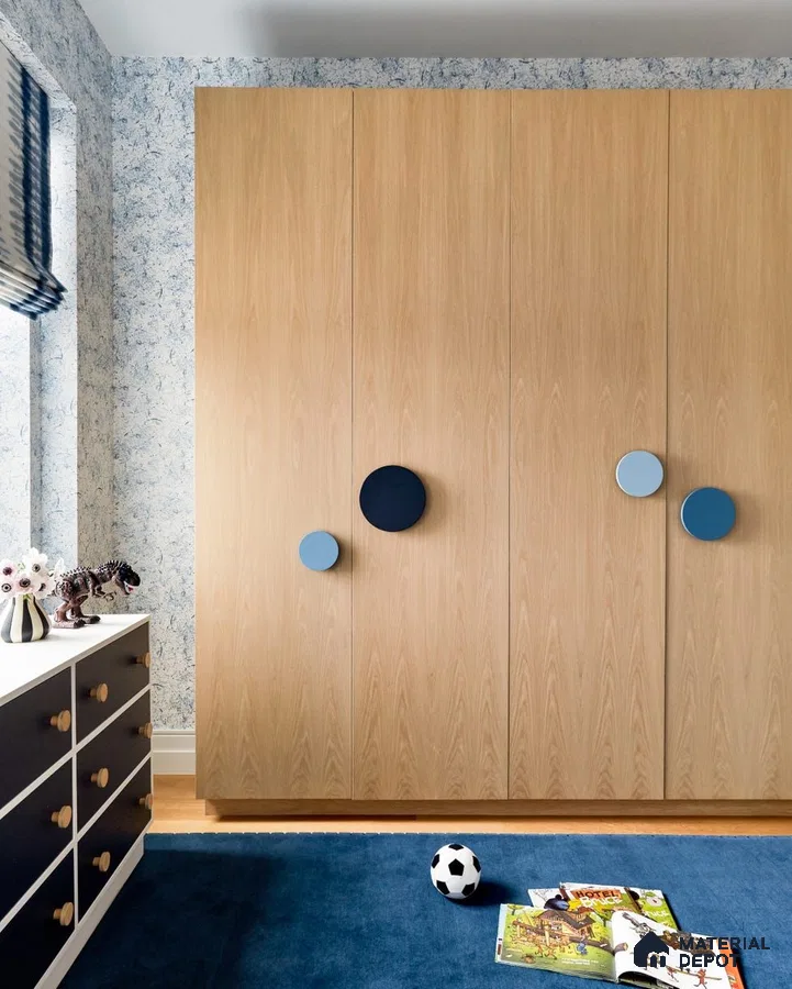Scandinavian kids room with light oak wardrobe, blue accent handles, and blue patterned wallpaper | Material Depot