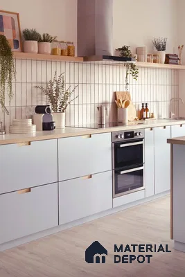 Scandinavian kitchen with frosty white laminate cabinets, oak wood accents, and vertical white subway backsplash tiles in Bengaluru | Material Depot