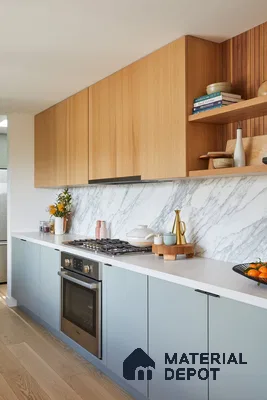 Scandinavian kitchen with light oak laminate, pastel blue laminate, and white marble backsplash in Bengaluru | Material Depot