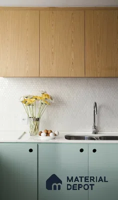 Scandinavian kitchen with oak wood laminate cabinets, pastel green laminate base, and white hexagonal tile backsplash in Bengaluru | Material Depot