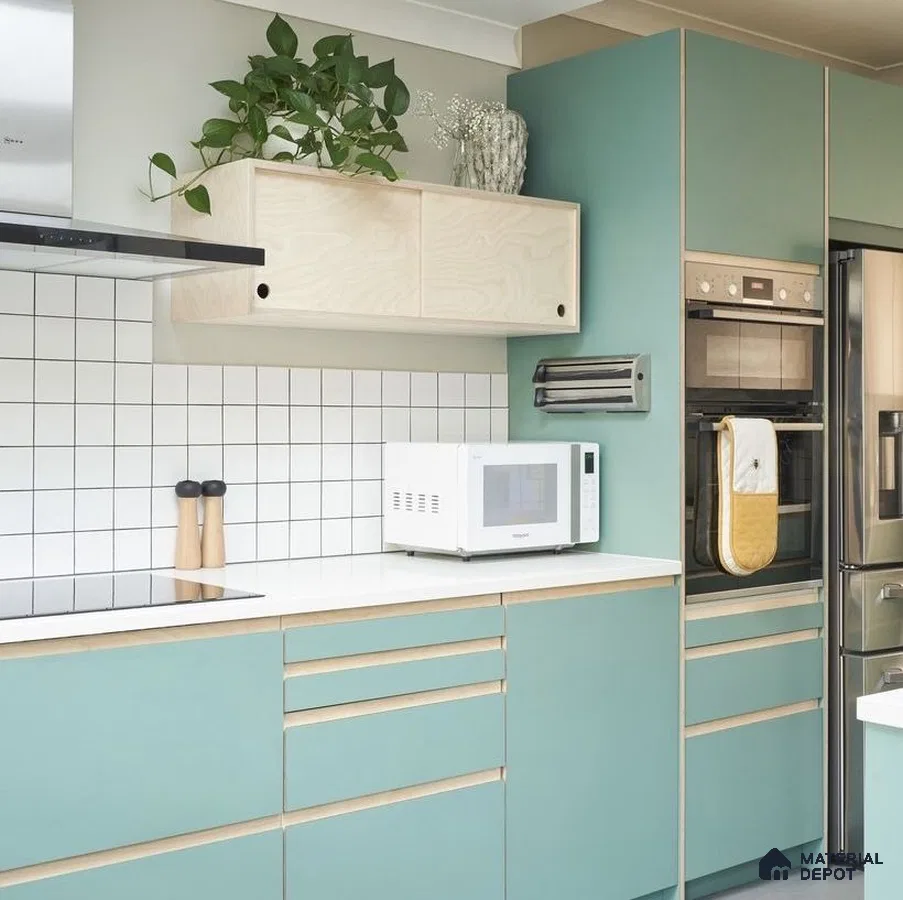 Scandinavian kitchen with pastel green laminate cabinets, birch wood accents, and white quartz countertop in Bengaluru | Material Depot