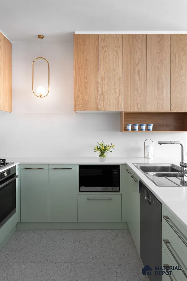 Scandinavian kitchen with pastel green laminate, natural oak laminate, and white quartz countertop in Bengaluru | Material Depot