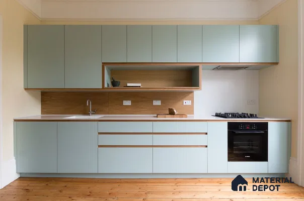 Scandinavian kitchen with pastel green laminate, natural oak laminate backsplash, and white countertop in Bengaluru | Material Depot