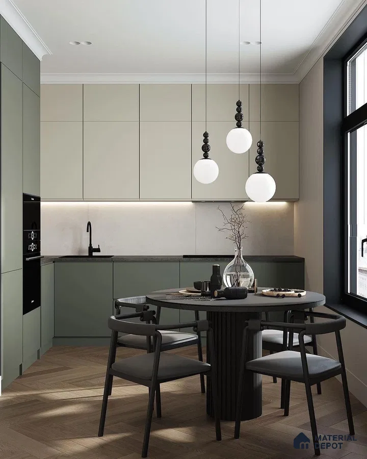 Scandinavian kitchen with sage green and beige laminate cabinets, matte black accents, and herringbone wood flooring in Bengaluru | Material Depot