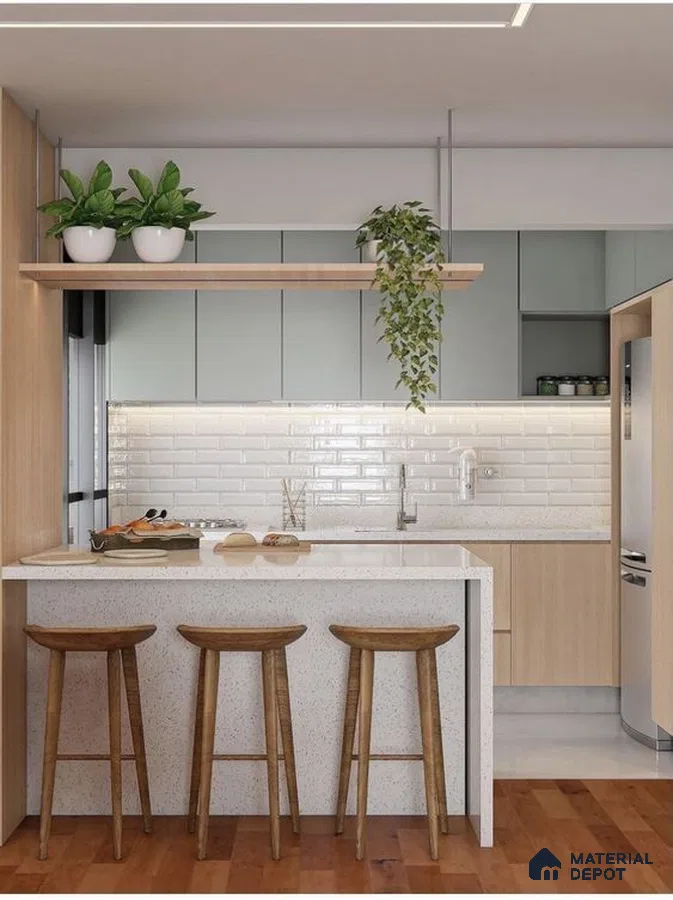 Scandinavian kitchen with sage green and light wood laminate, terrazzo countertop, and white subway tile backsplash in Bengaluru | Material Depot