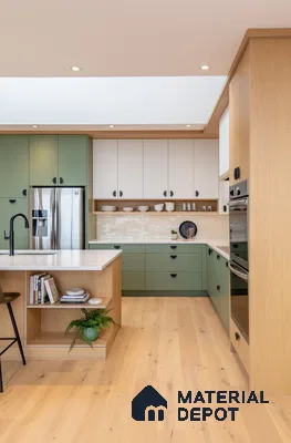 Scandinavian kitchen with sage green and white laminate cabinets, white quartz countertop, and light oak wood flooring in Bengaluru | Material Depot