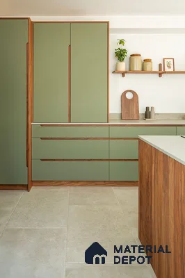 Scandinavian kitchen with sage green laminate cabinets, walnut wood accents, and beige stone floor tiles in Bengaluru | Material Depot