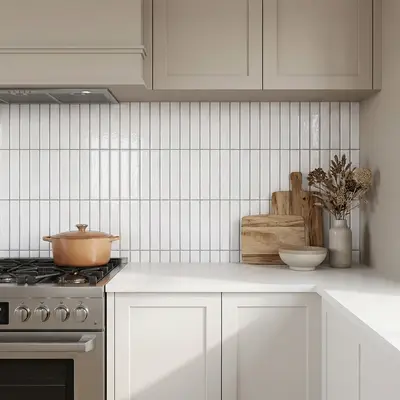 Scandinavian kitchen with white kitkat wall tiles and frosty white quartz countertop