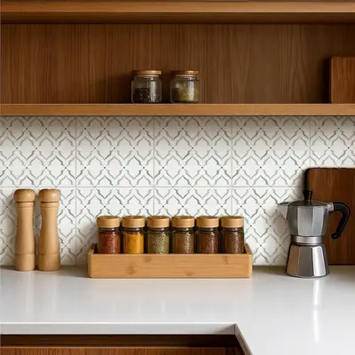 Scandinavian kitchen with white quartz countertop, oak wood laminate cabinets, and geometric patterned backsplash tiles