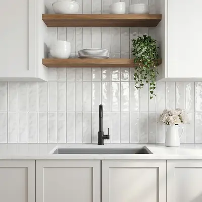 Scandinavian kitchen with white vertical subway backsplash tile, white quartz countertop, and oak open shelves