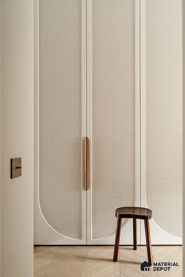 Scandinavian wardrobe with cane shutters, ivory laminate, and herringbone wood flooring | Material Depot