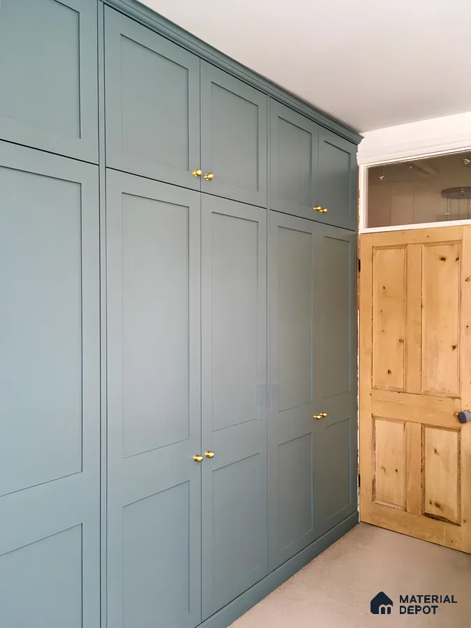 Serene Bedroom with Teal Painted Wardrobe and Brass Hardware | Material Depot