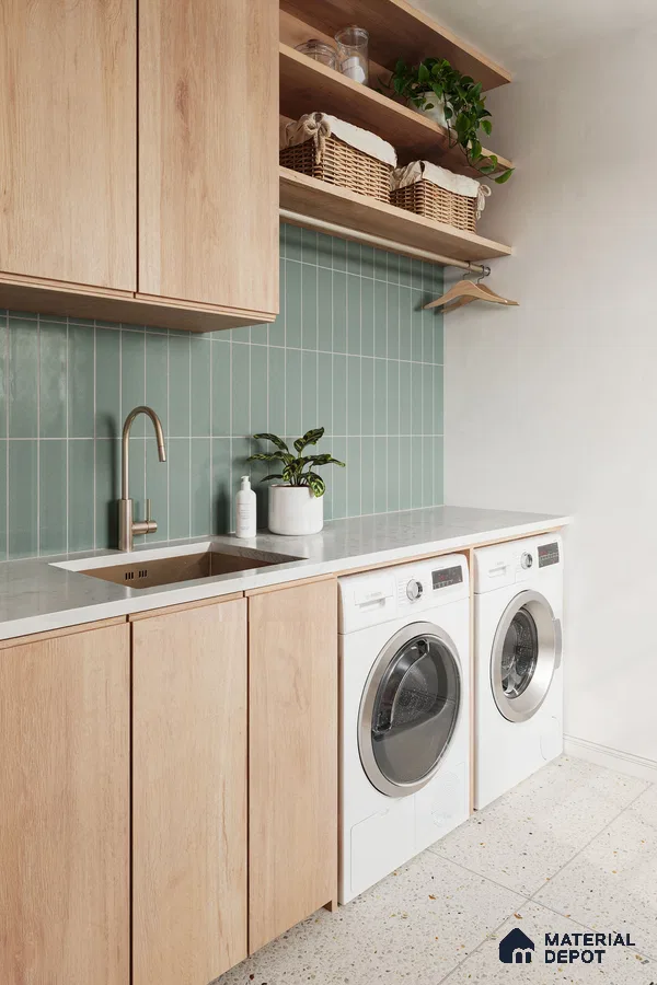 Serene Green Tiled Laundry Room with Wood Cabinets and Terrazzo Floor | Material Depot