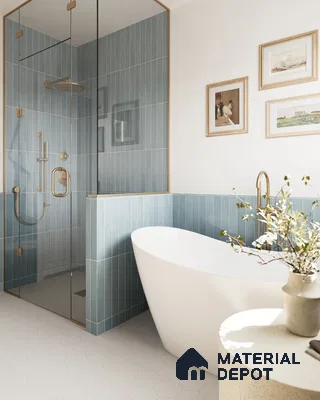 Serene Modern Bathroom with Blue Tiled Shower and Freestanding Tub, and White Tile Floor | Material Depot