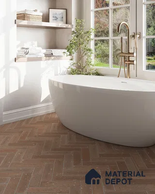 Serene Modern Bathroom with Freestanding Tub, Herringbone Tile Floor, and Natural Light | Material Depot