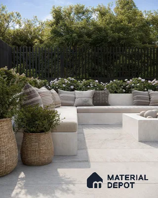 Serene Outdoor Patio with White Porcelain Tile Flooring, Fire Pit, and Lush Greenery | Material Depot
