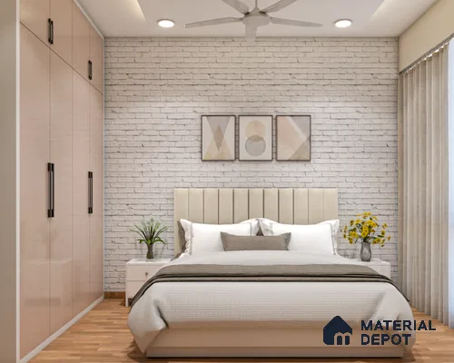 simple and stylish bedroom with a white brick wall, three framed artworks, a bed, a plant, and a flower vase
