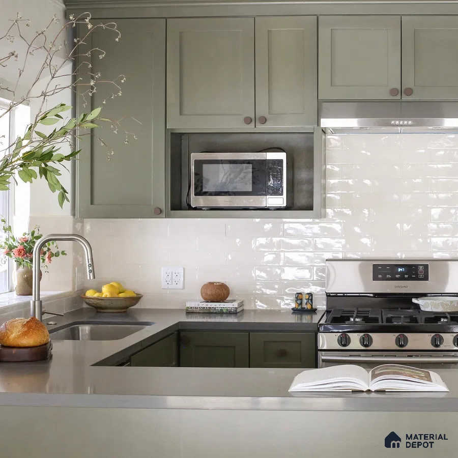 Kitchen unit with green laminate cabinet and faucet