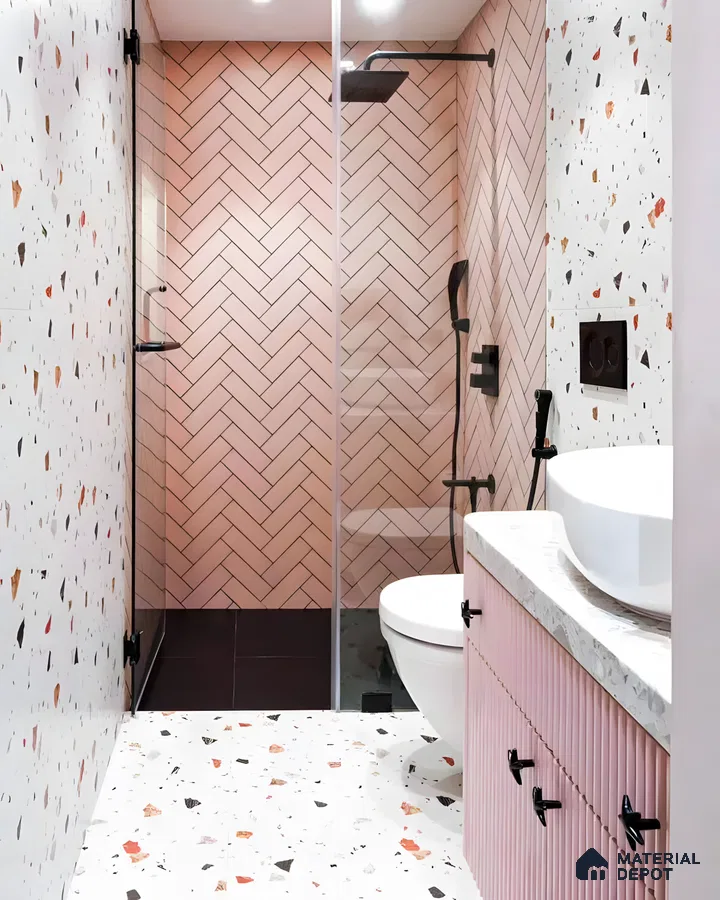 Soft Pink Herringbone Tiles with Bold Terrazzo Accents in a Modern Bathroom | Material Depot
