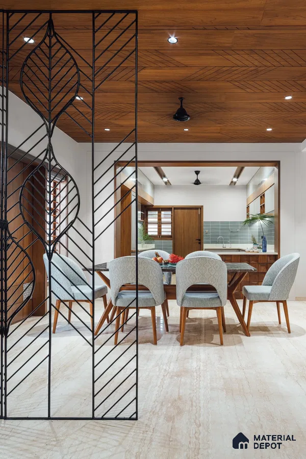 Sophisticated Dining Space with Intricate Metal Divider | Material Depot
