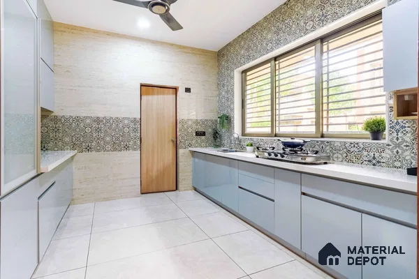 Spacious light blue kitchen in Ahmedabad 3 BHK flat.