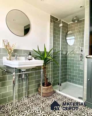 Stylish Bathroom Featuring Green Subway Tiles and Artistic Floor Design | Material Depot