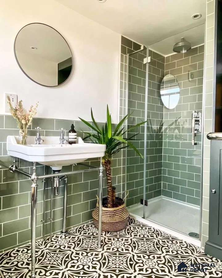Stylish Bathroom Featuring Green Subway Tiles and Artistic Floor Design | Material Depot