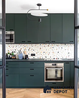 Stylish Kitchen Featuring Green Cabinets and Vibrant Terrazzo Backsplash | Material Depot