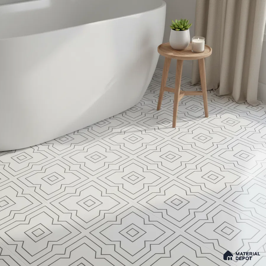 Minimalist bathroom with geometric black-and-white floor tiles and freestanding tub