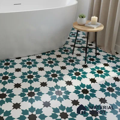 Modern bathroom with teal and black geometric moroccan floor tiles and freestanding tub