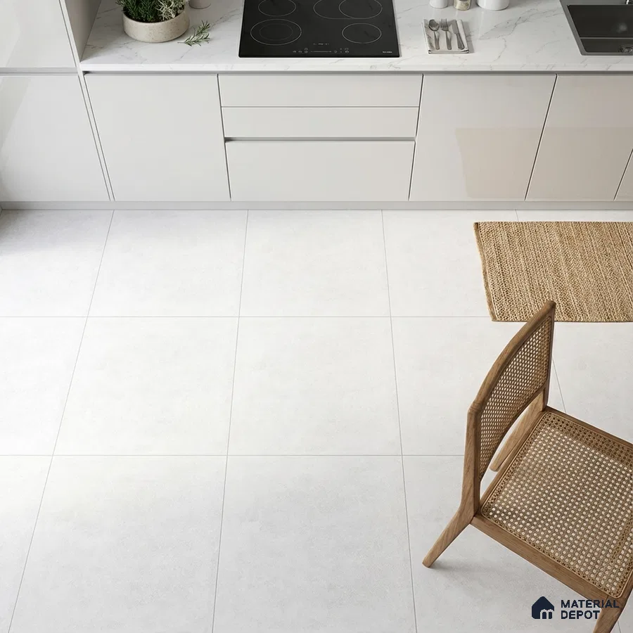 Minimalist kitchen with frosty white laminate cabinets, white marble-look countertop, and large format white floor tiles