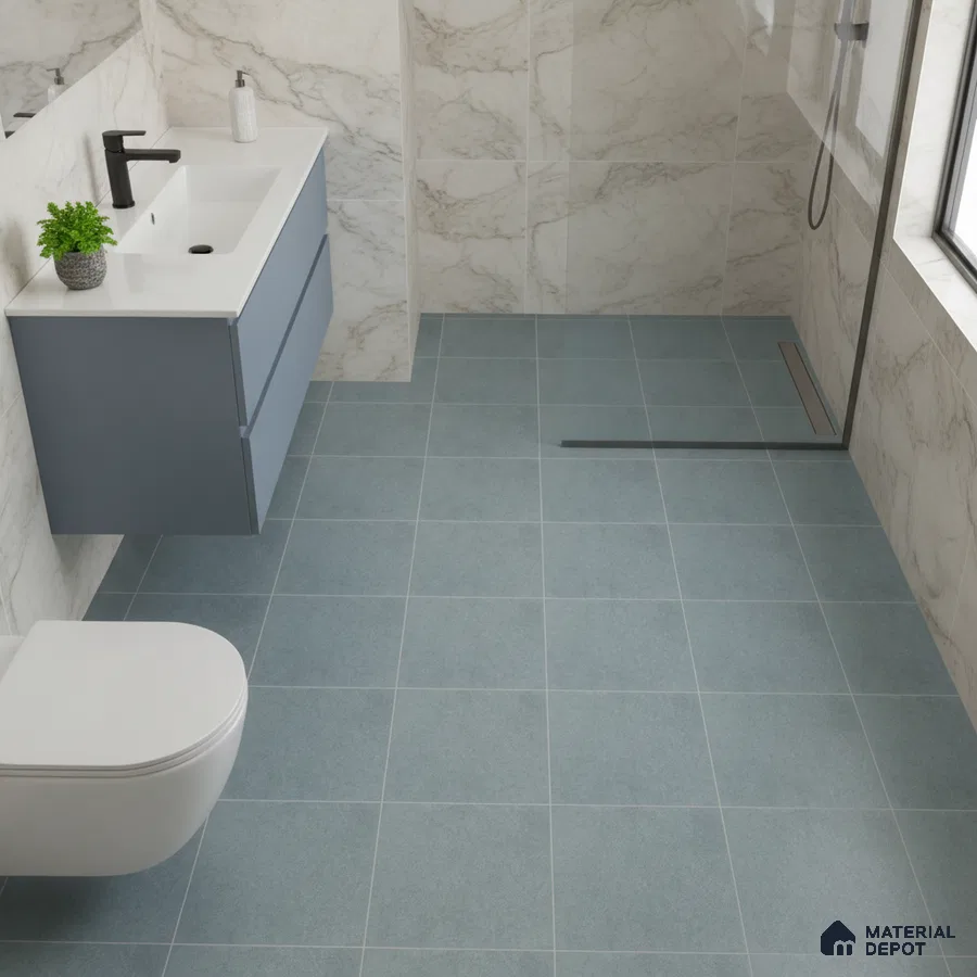 Modern bathroom with marble-look wall tiles, blue floor tiles, and matte blue floating vanity