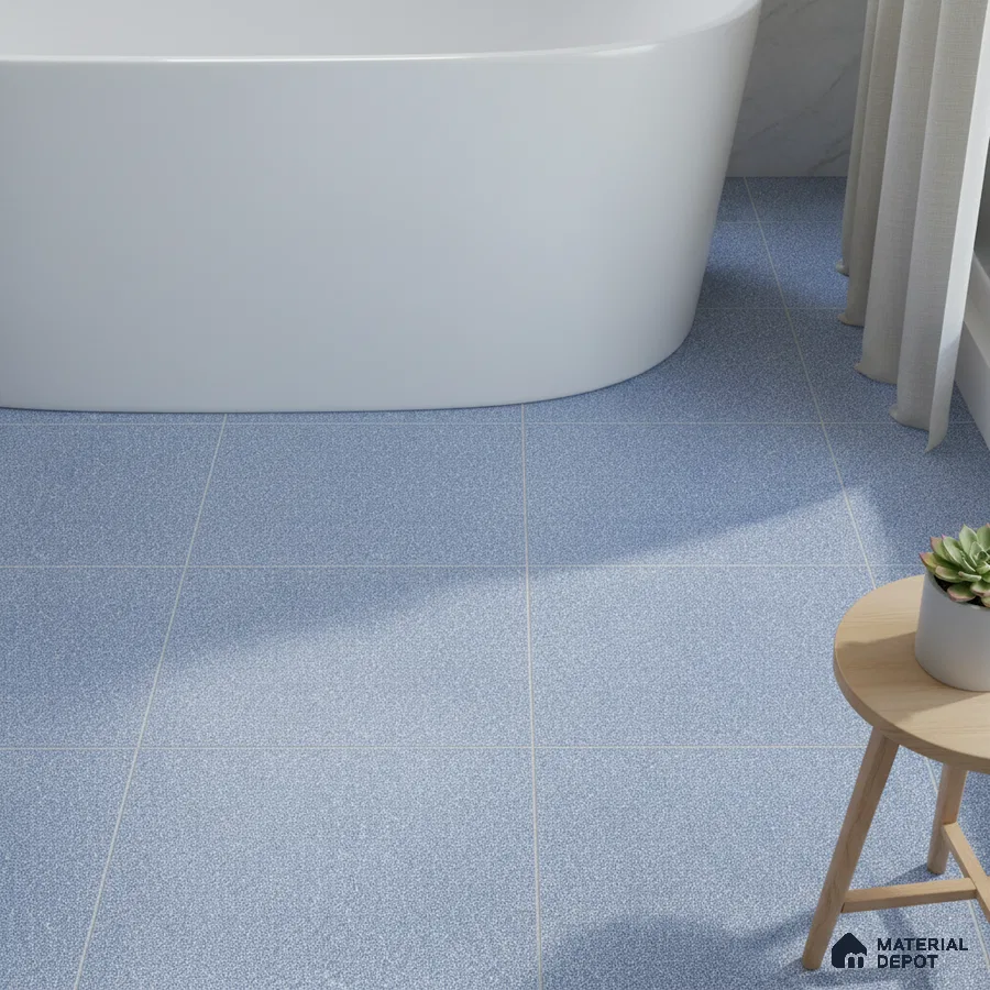 Minimalist bathroom with blue speckled floor tiles and freestanding tub