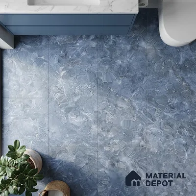 Modern bathroom with blue marble-look floor tiles and white marble countertop