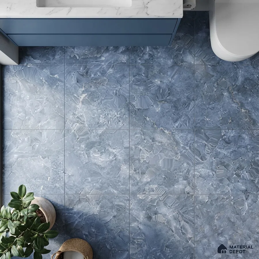 Modern bathroom with blue marble-look floor tiles and white marble countertop