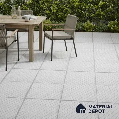 Minimalist outdoor patio with light grey diagonal line floor tiles and natural wood dining set