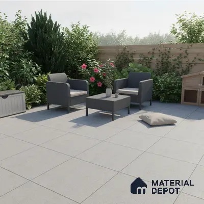Modern outdoor patio with grey stone-look floor tiles and rattan furniture