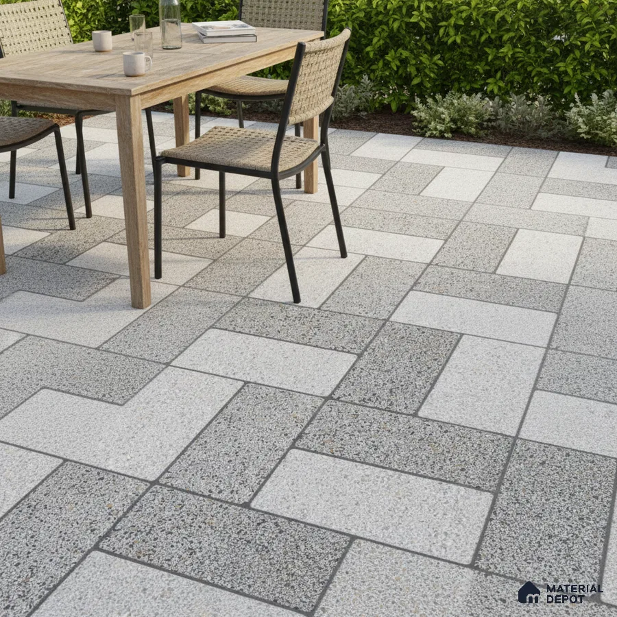 Modern outdoor patio with grey and white terrazzo floor tiles and natural wood dining set