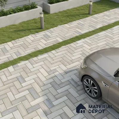 Modern parking with herringbone patterned outdoor tiles and grass strips