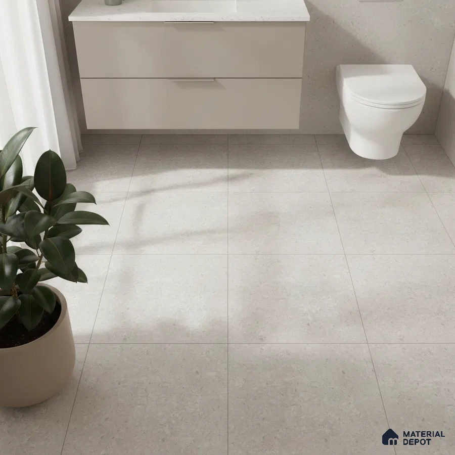 Minimalist bathroom with matte beige stone floor tiles and frosty white floating vanity