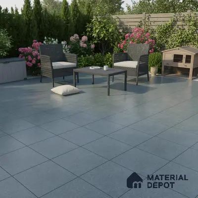 Modern outdoor patio with grey stone-look floor tiles and wicker furniture