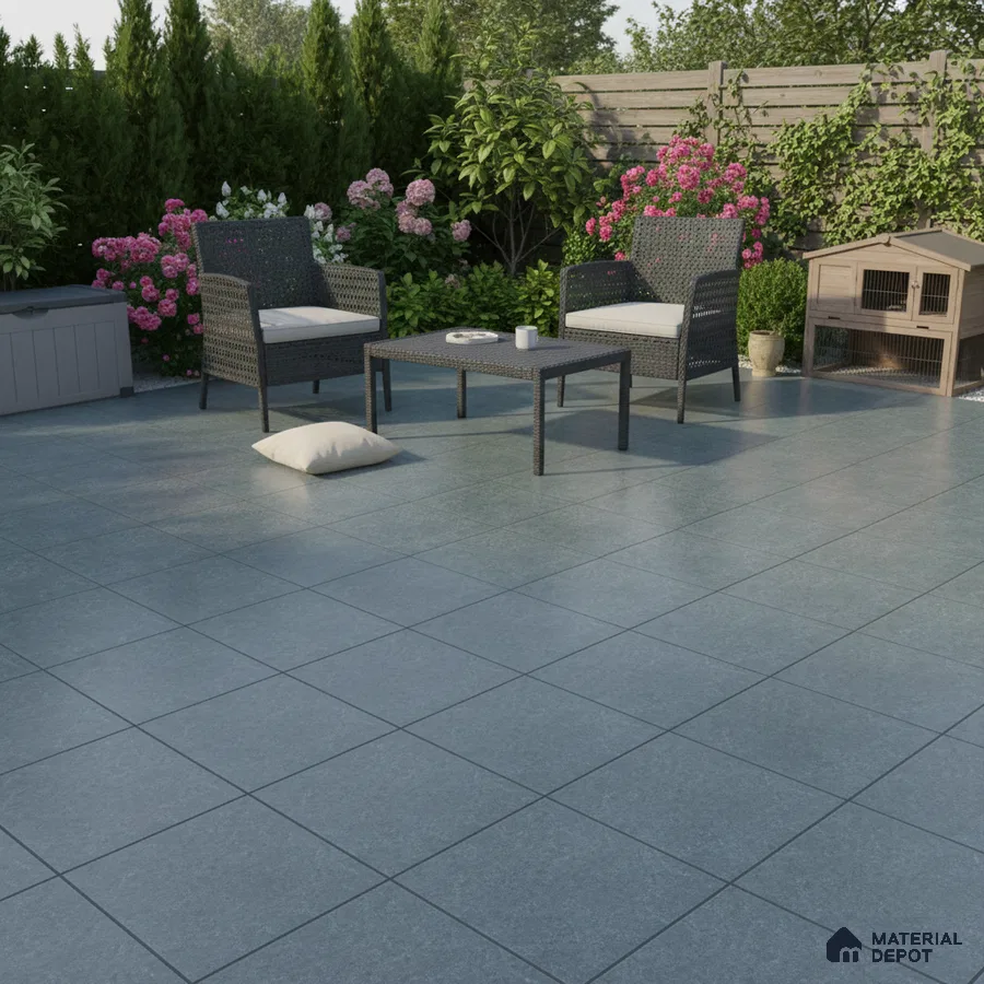 Modern outdoor patio with grey stone-look floor tiles and wicker furniture