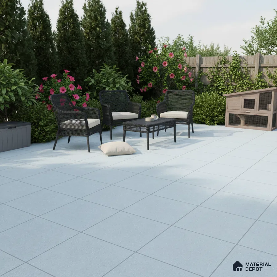Modern outdoor patio with light grey floor tiles and black wicker furniture