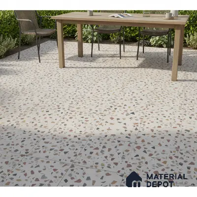 Modern outdoor space with multicolor terrazzo floor tiles and natural wood dining table