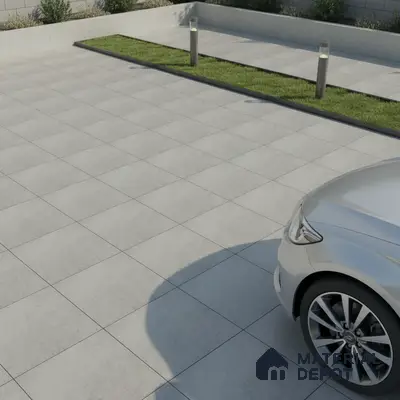 Minimalist parking area with light grey stone-look anti-skid floor tiles